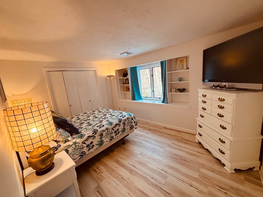 queen bedroom with dresser and TV/Roku