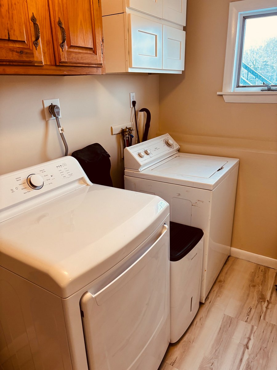 lower level laundry room with washer and dryer / mudroom