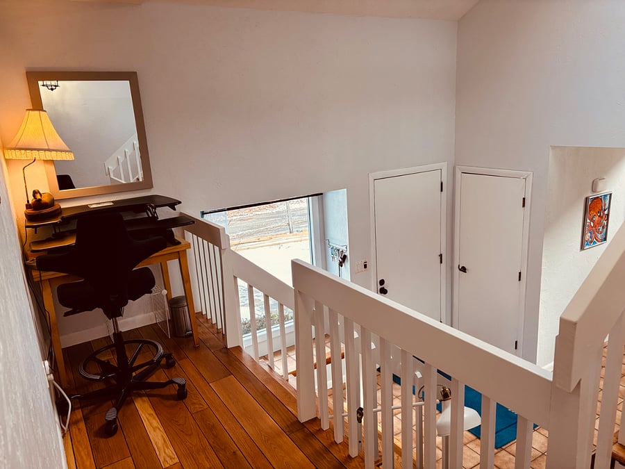stand-up desk with chair on the 2nd floor landing
