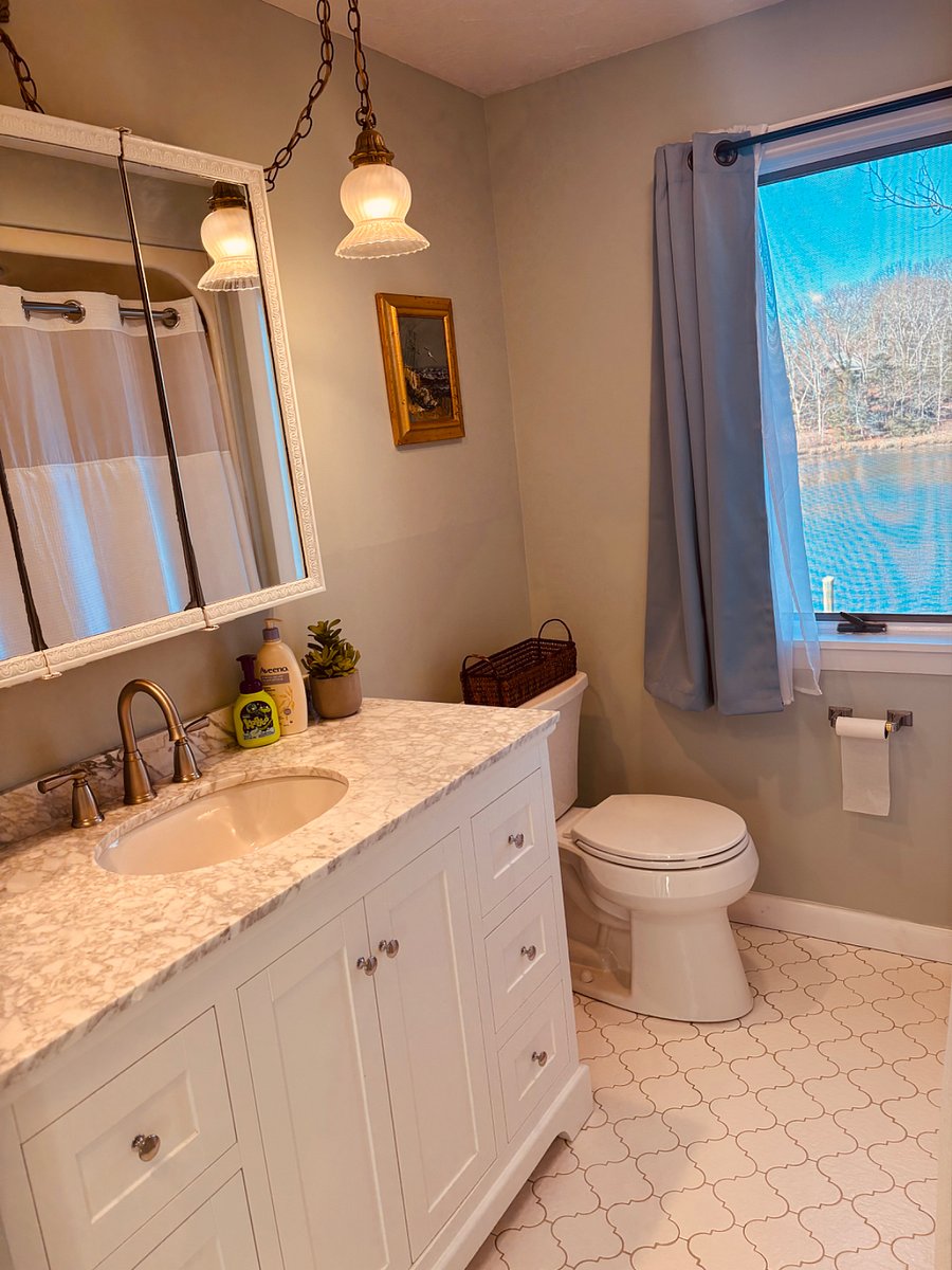 2nd floor bathroom with marble vanity and shower