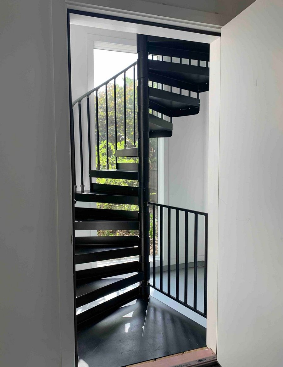 Spiral staircase to enter unit from garage.