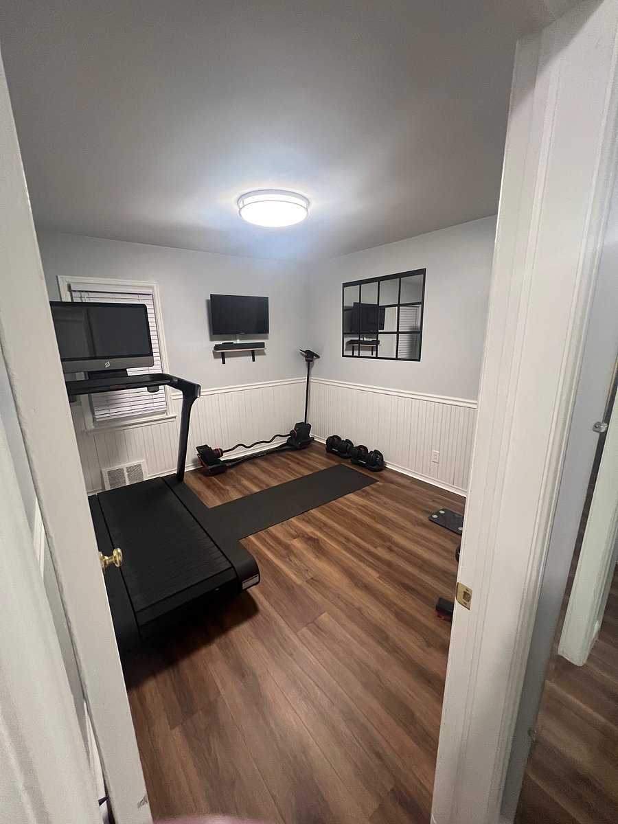 in home gym! Peloton treadmill, weights and much more. This room can also be converted to a bedroom upon request.