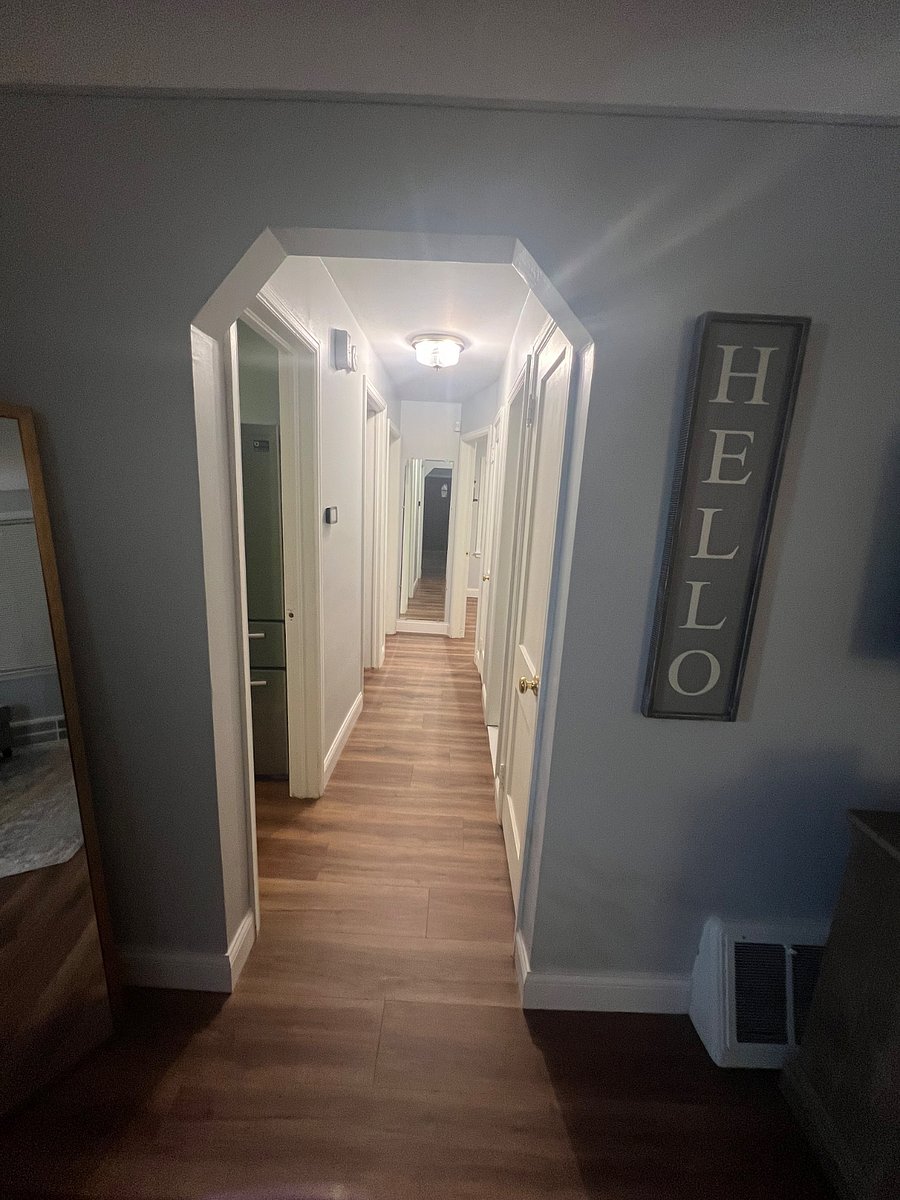 hallway going to two rooms from the living room