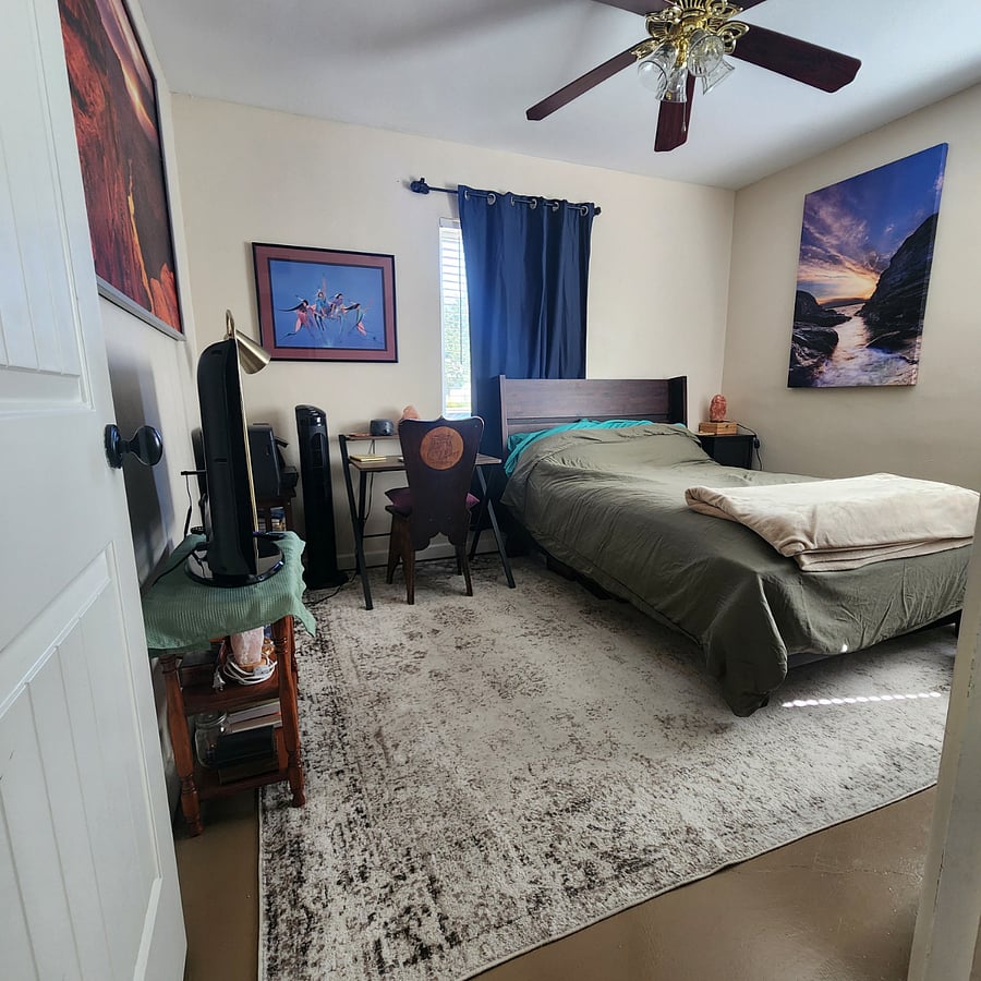 Guest bedroom with blackout curtains.