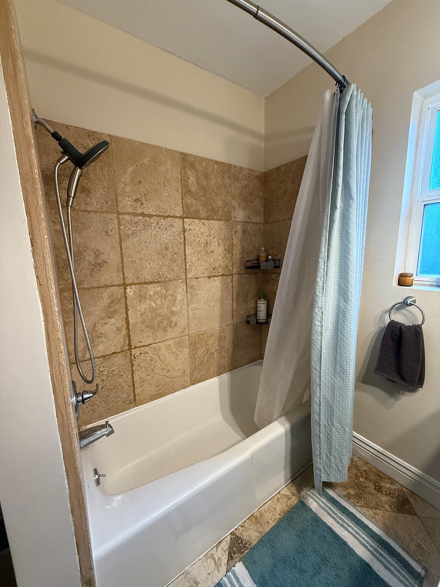 Bathtub and shower.