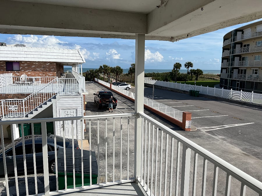 Partial Ocean View from Deck Patio. Easy walk to beach. Parking pass for residents available for extra car or guests.