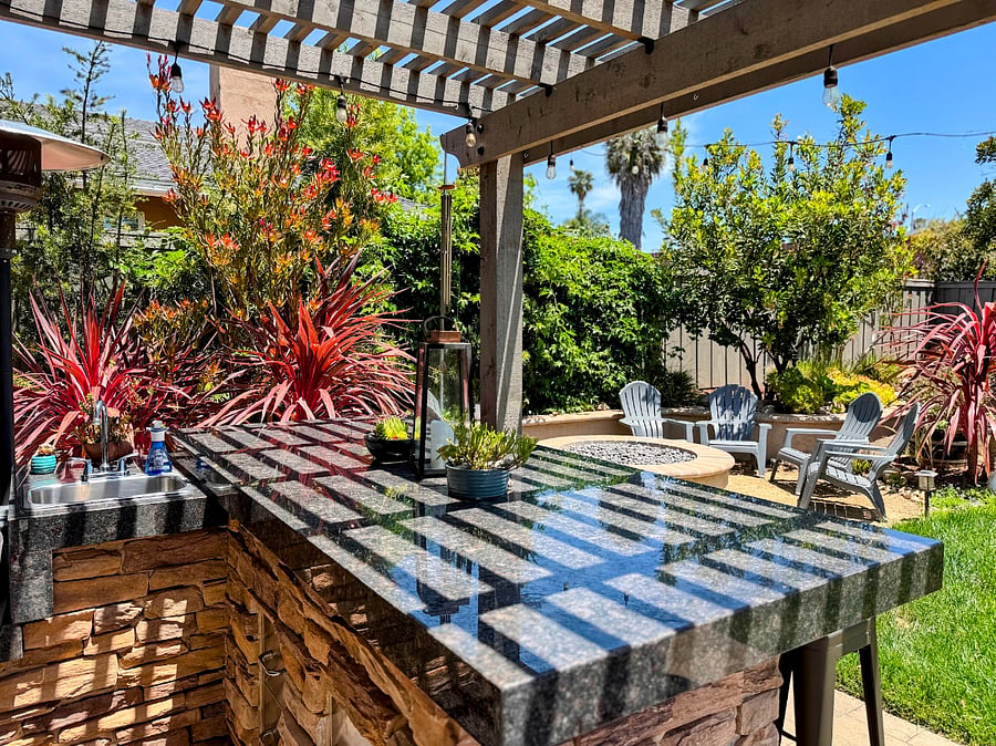 Large outdoor island with Traegar grill and sink.