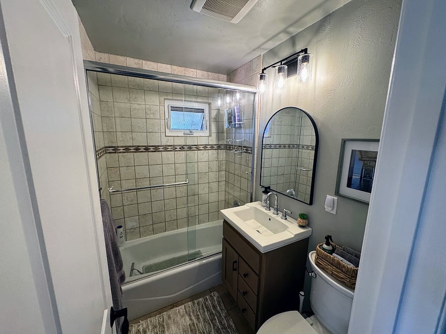 Second bath with shower tub combo.