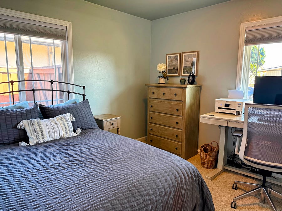 Dedicated office space with sit-stand desk and an additional full bed.