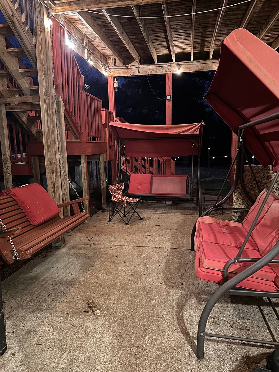 Downstairs right off the unit in the backyard at night. Really cool place to be at night.B
