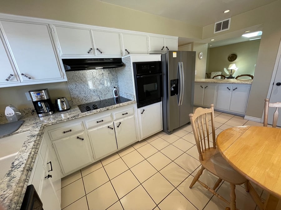 The kitchen has been updated with new appliances, dining cutlery, and pots and pansG.