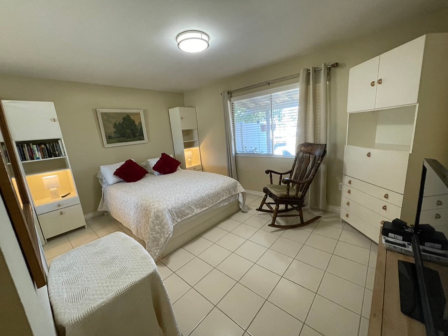 The guest bedroom offers a queen-size bed.