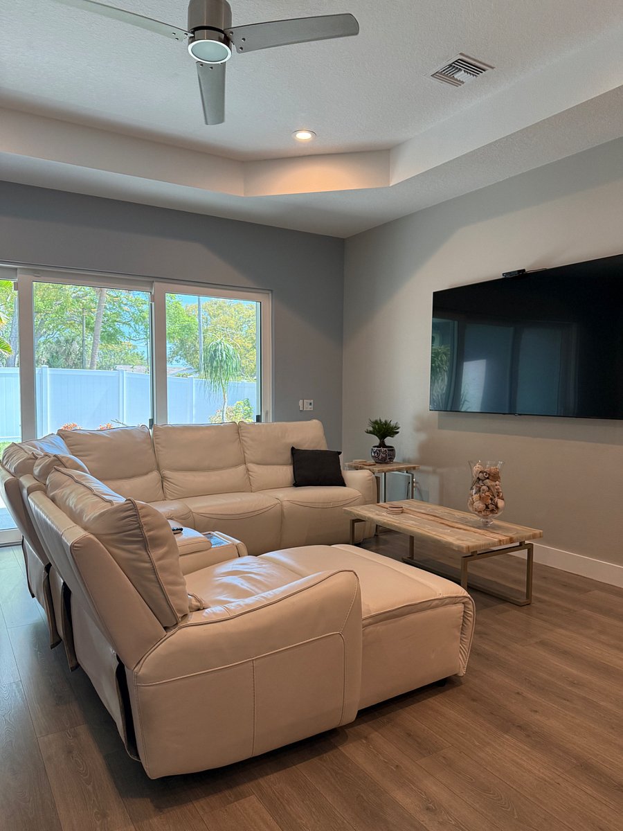 Bright open floor plan family room with 75 smart tv