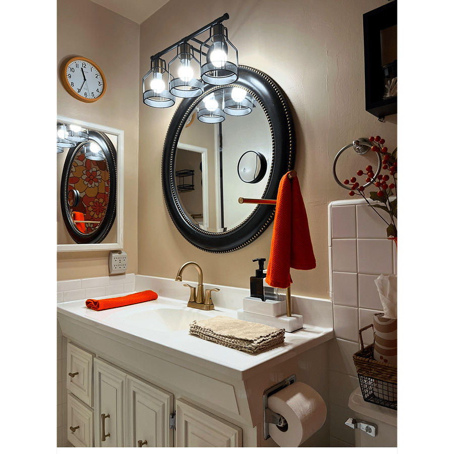 Bathroom vanity has a medicine cabinet to the left and a small magnifying mirror attache to the man mirror. Vanity includes 6 small drawers and under sink space for largre items