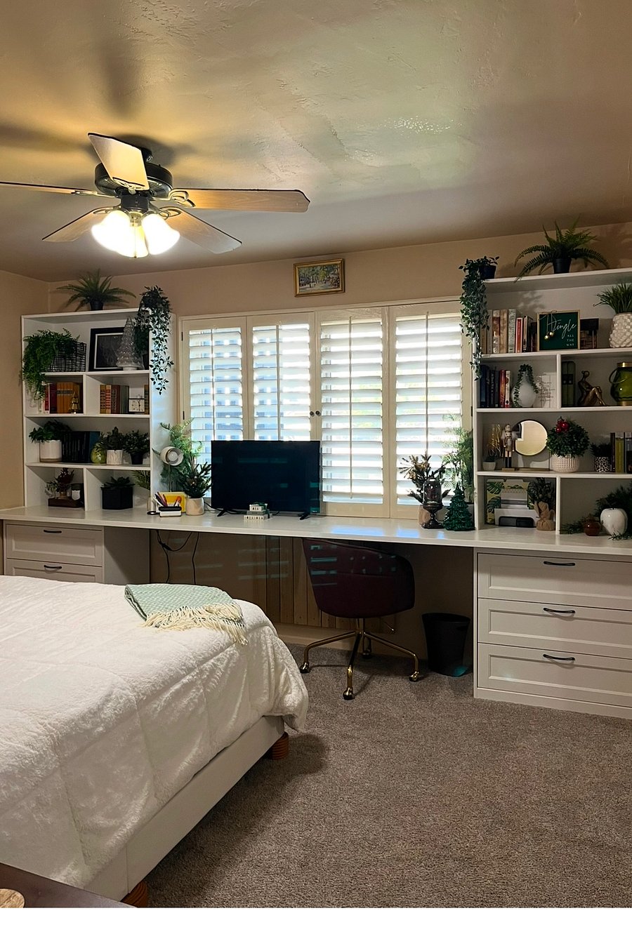 Master with queen bed, tv and work station. 3 drawers on each side of the work station eliminates the need for dressers