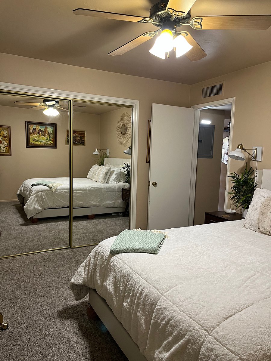 Master bedroom with large closet and shelving on the inside in the middle.