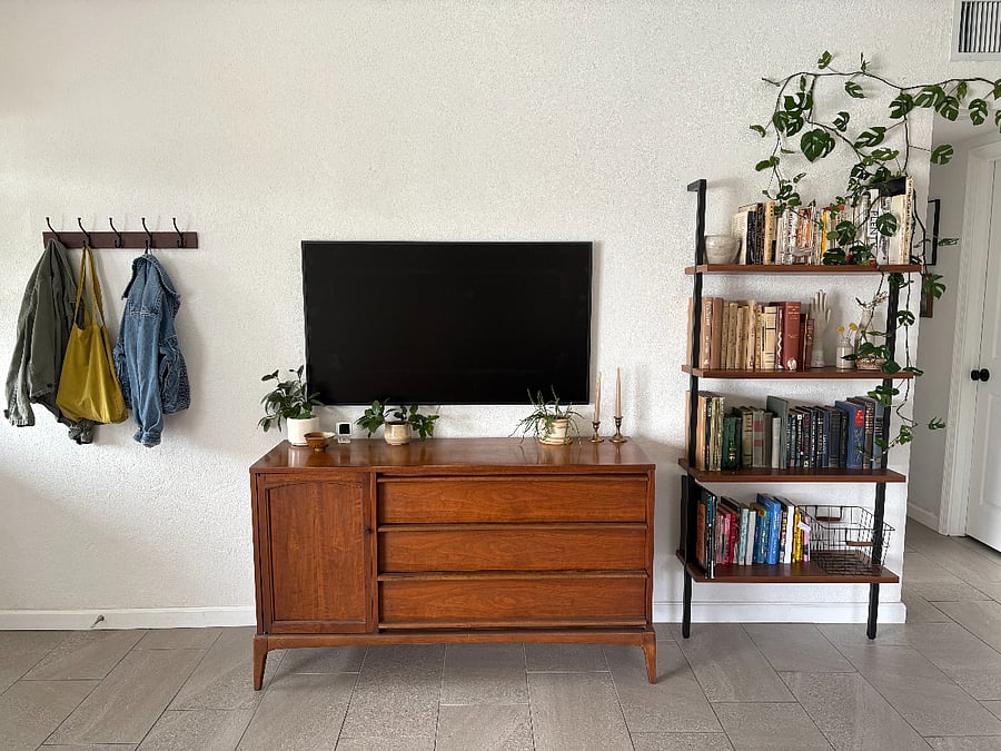 Living room with 50" Samsung frame TV. Extra storage space available in credenza.