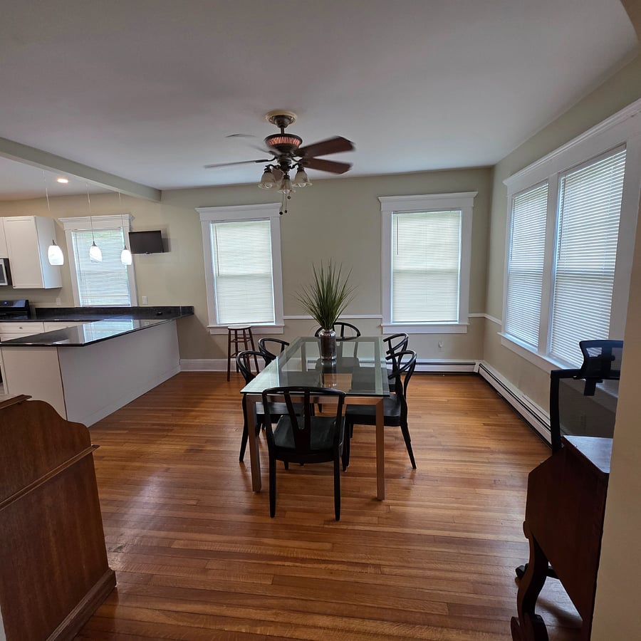 Spacious dining area for 6+ open space at kitchen breakfast bar.