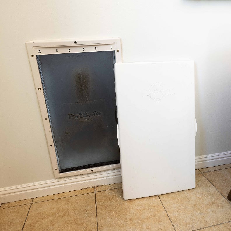 Large doggy door leads to a securely fenced backyard just for your furry friend 