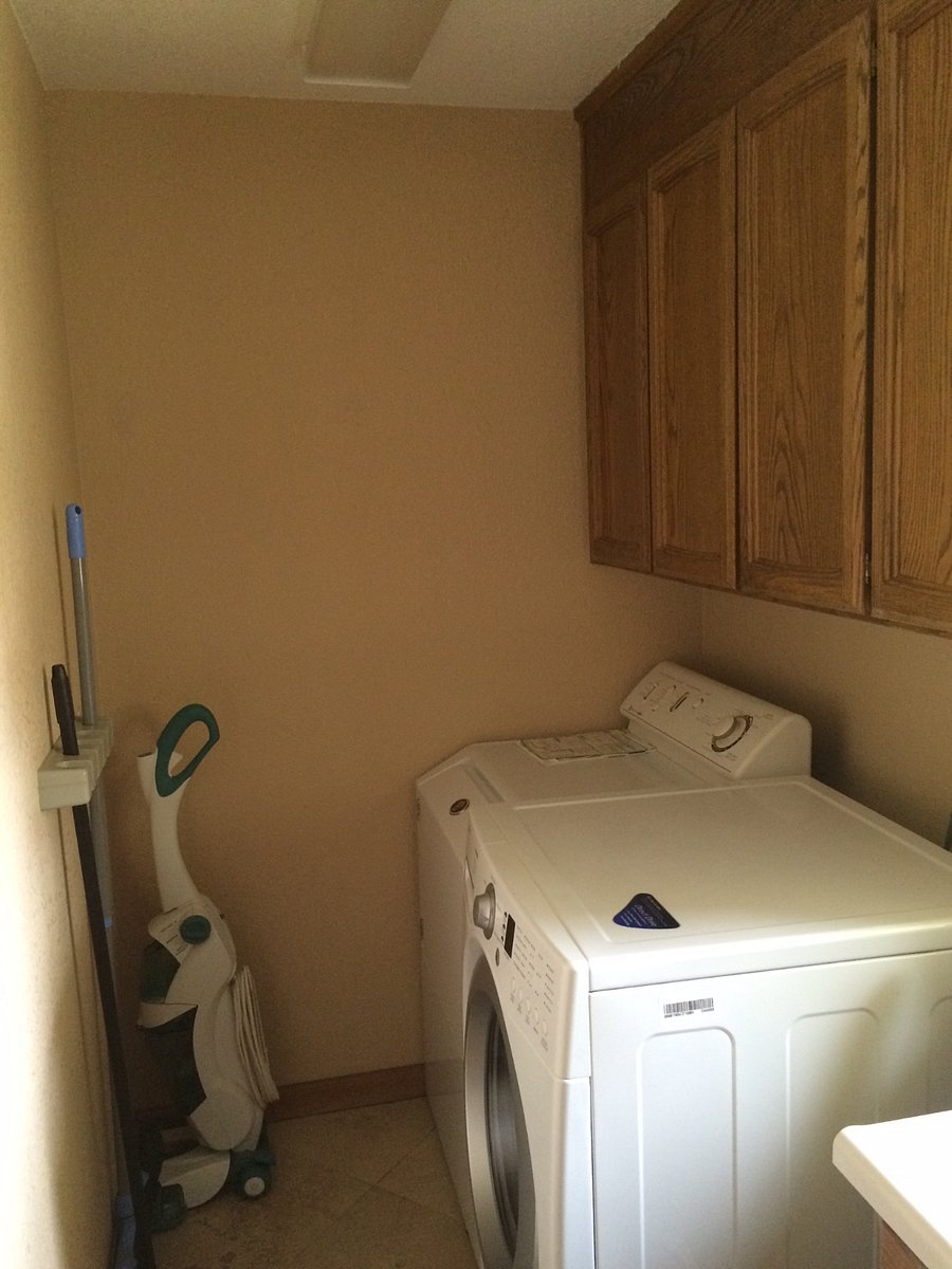 washer, dryer, ironing board, microwave