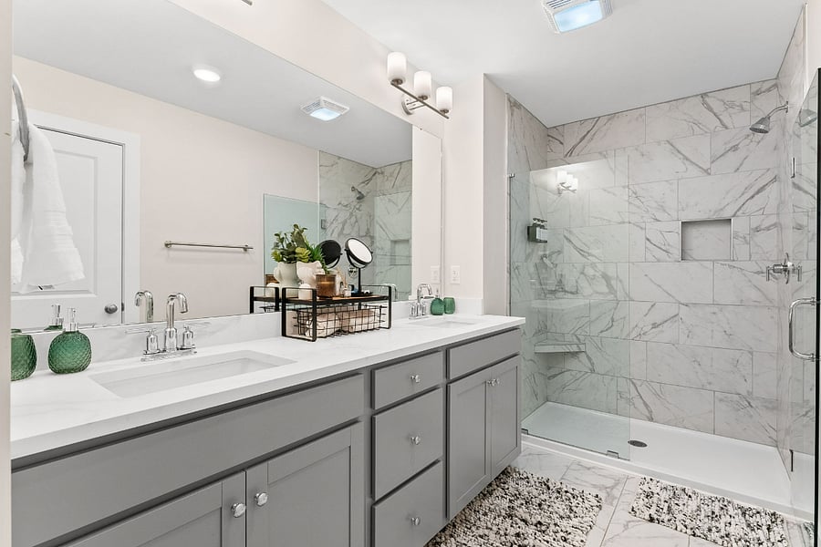 Beautiful dedicated en-suite bathroom for upstairs suite. Double sink, private water closet, and beautiful walk in tiled shower