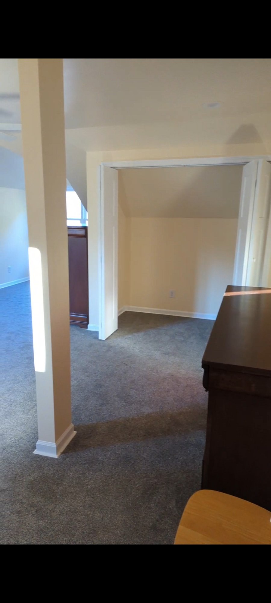 Closet open. Dresser on right.