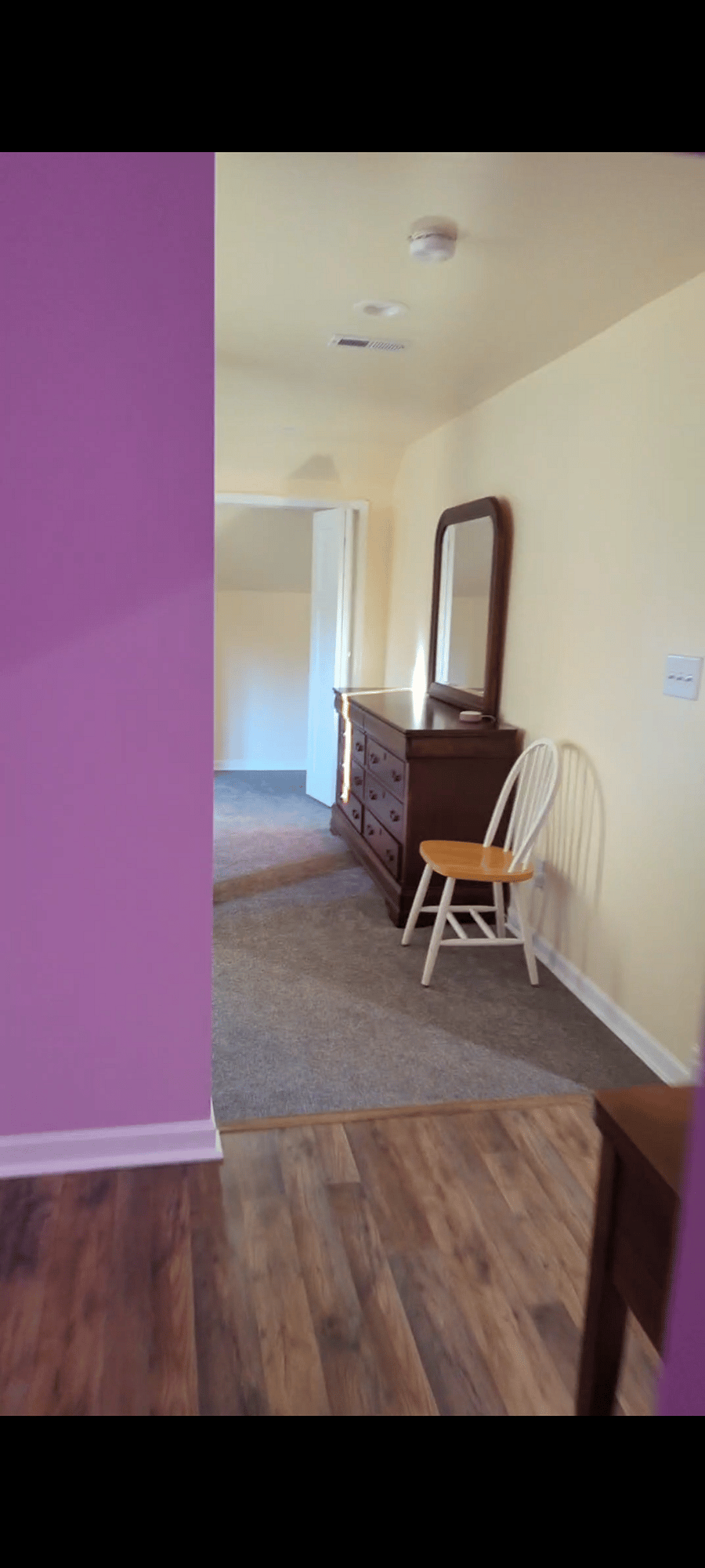 Bedroom entrance  mirrored dresser and closet 