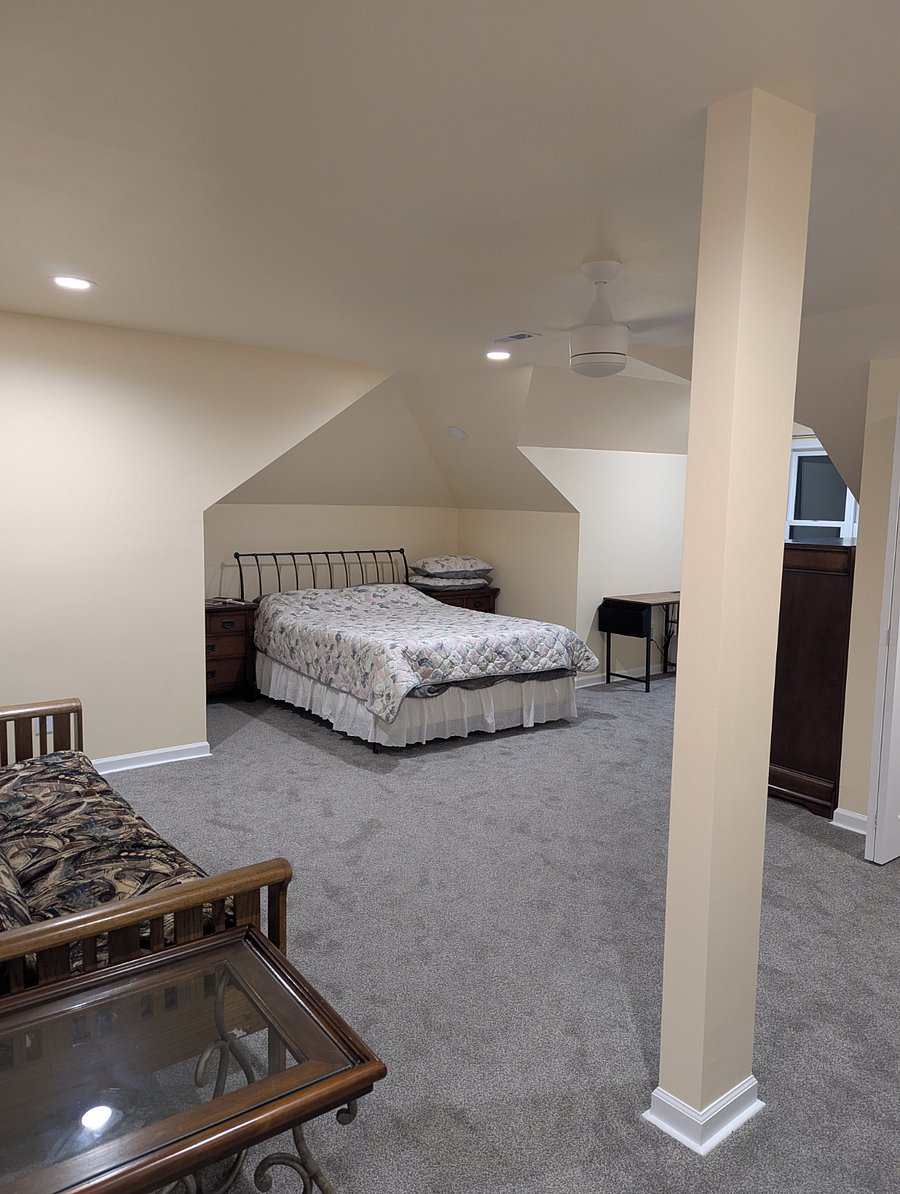 Queen bed & futon on left