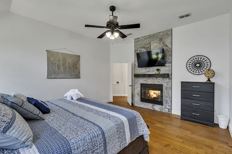 Master bedroom different view of gas burning ceramic fireplace