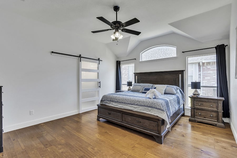 The master bedroom suite has a fireplace and spa master bath with a large walk-in closet and Smart TV