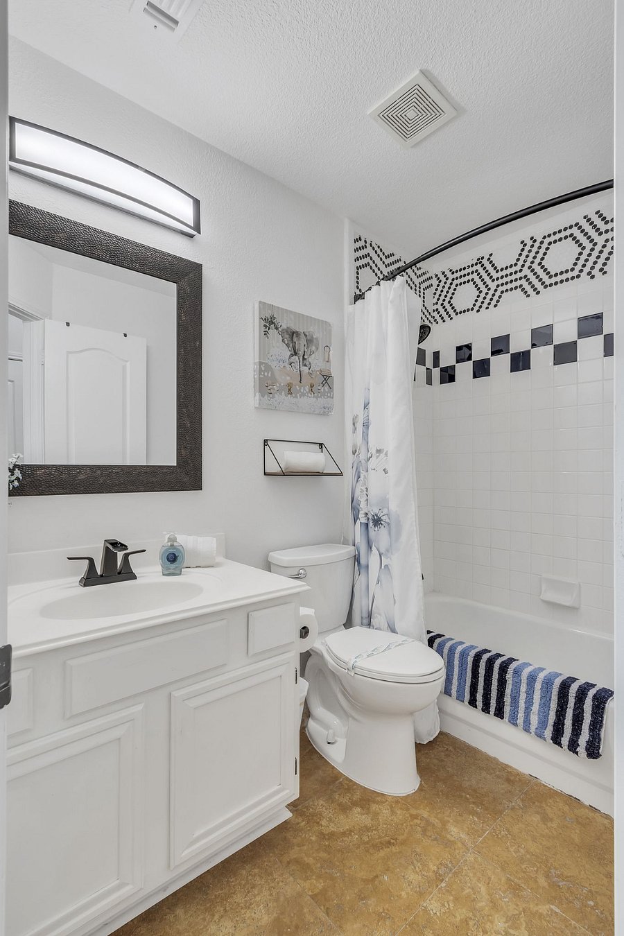 Hall bathroom near two bedrooms Shower/tub combo.