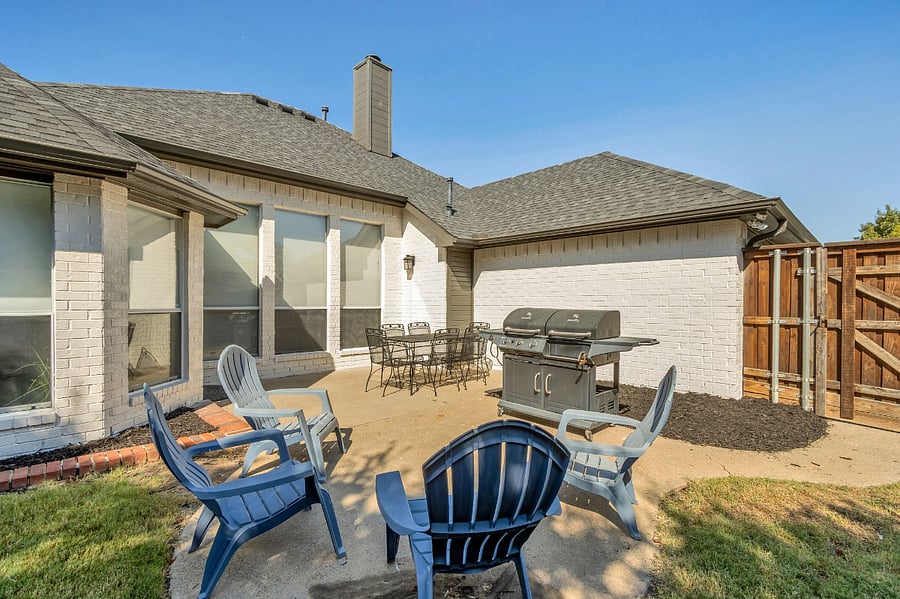 Patio seating for 6 plus relaxing yard chairs for 4 in a fully fenced and private backyard.