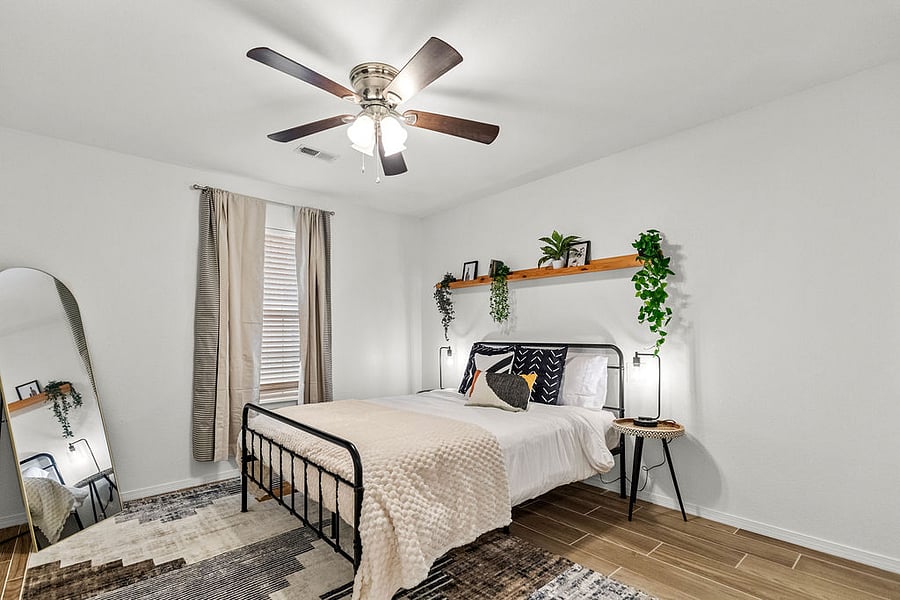 Second bedroom with full length arched mirror