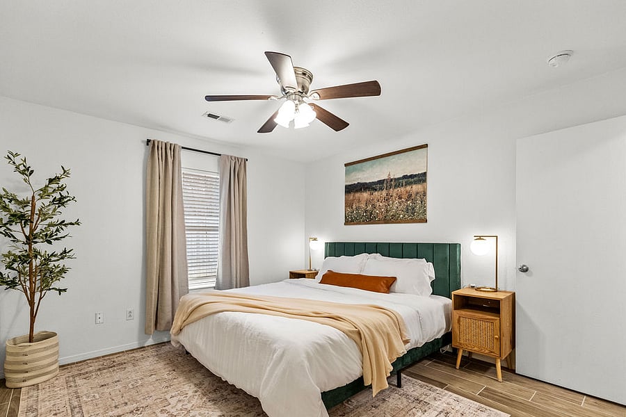 Primary bedroom with king bed and en suite full bathroom