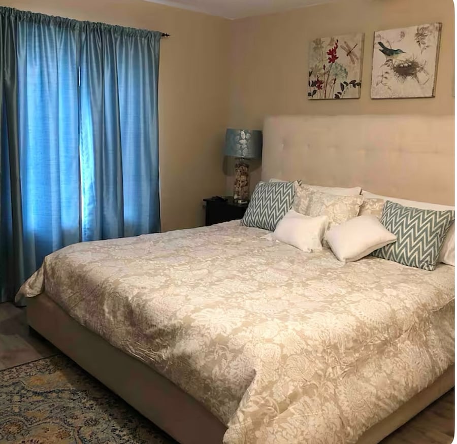 Tranquil bedroom with Cal king bed. End unit so no shared walls. Television in bedroom for nighttime relaxation. 
