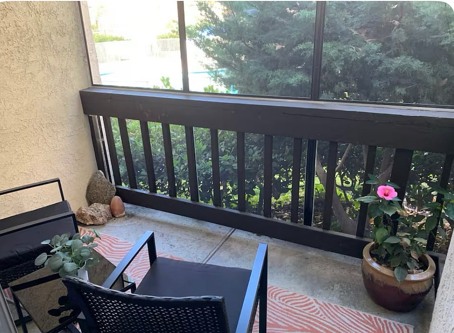 Relaxing poolside screened-in balcony with table and chairs. Have a glass of wine and enjoy the weather. 
