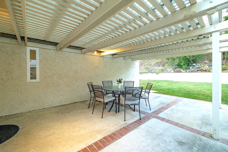 Enjoy this gorgeous fenced in backyard and outdoor sitting area.