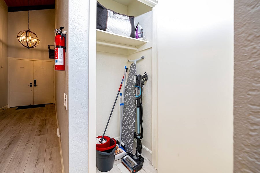The house includes a Pack 'n Play, a vacuum, and an iron with an ironing board for your convenience.