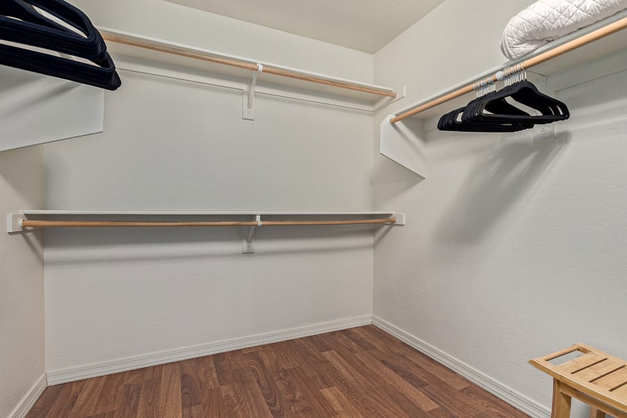Primary bedroom walk-in closet