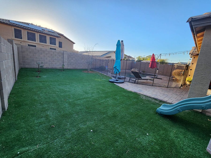 Large turf area featuring large umbrella for shade