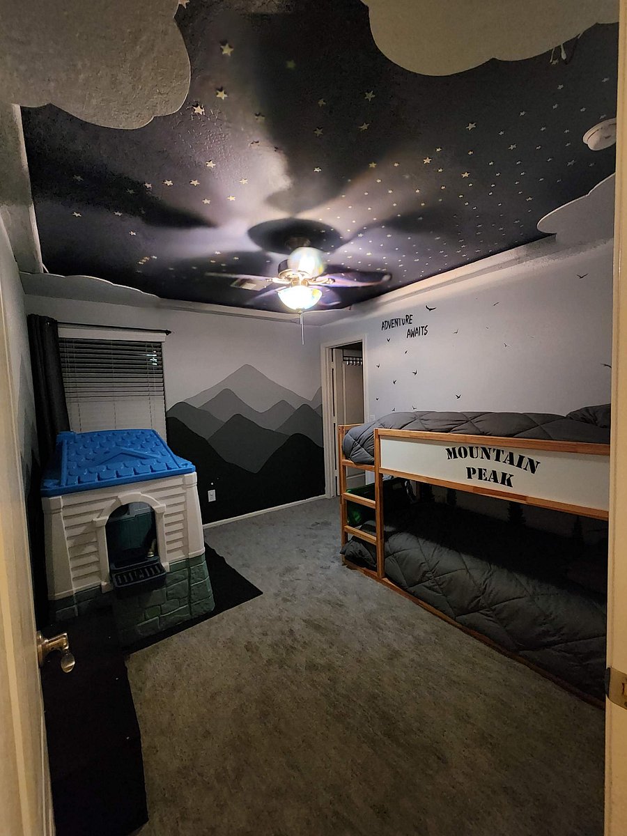 Kids bedroom with playhouse and twin bunkbeds 