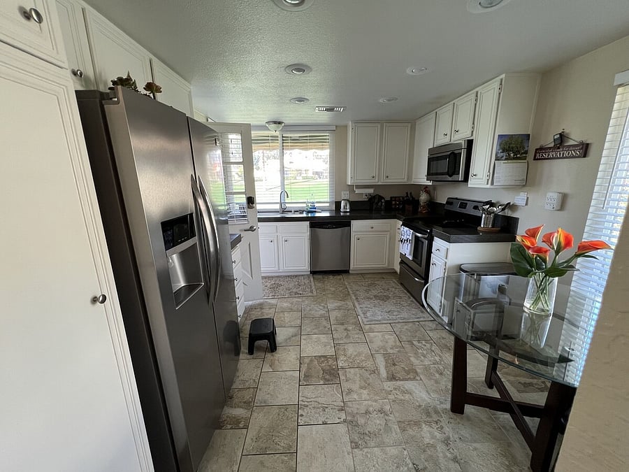Kitchen with dishwasher, stove, oven, microwave, refrigerator