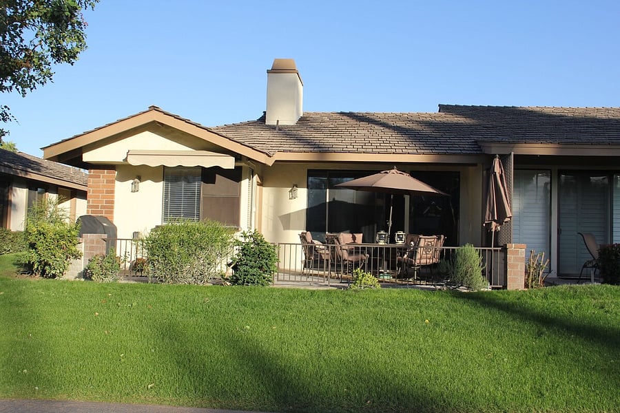 Southwest facing patio with patio table, chairs and BBQ