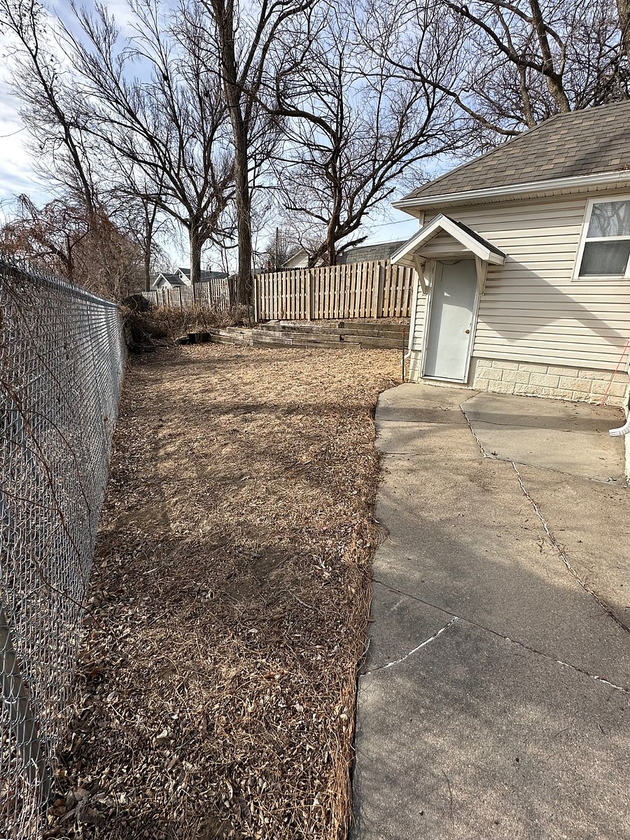 Backyard fenced on 3 sides