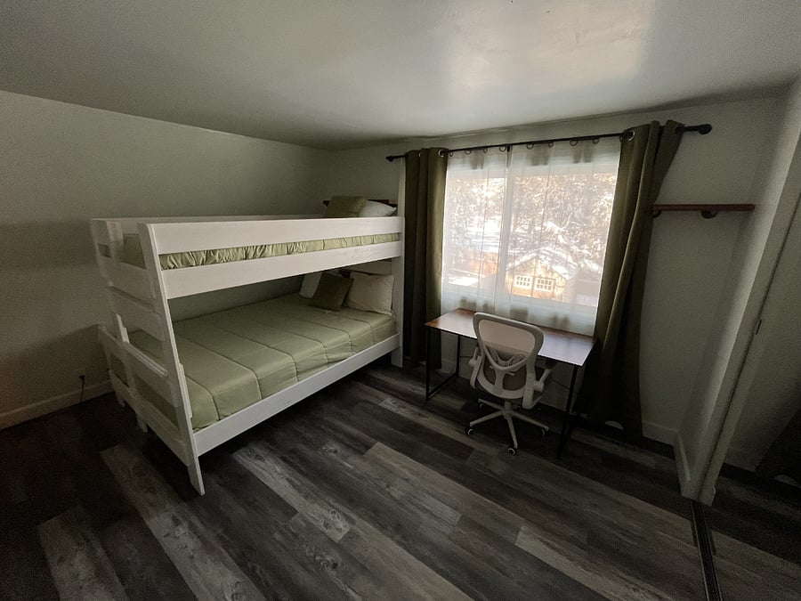 Bedroom with a bunk bed. {A Queen and a twin bed}.