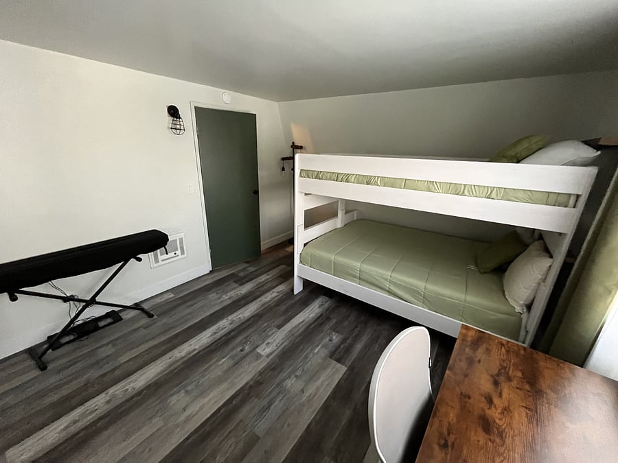 Bedroom with a bunk bed. {A Queen and a twin bed}. 