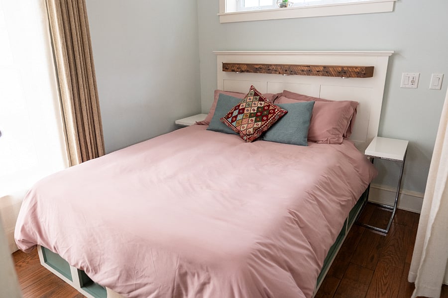 Queen sized bed. More storage space/cubby's on either side of bed (under duvet)
