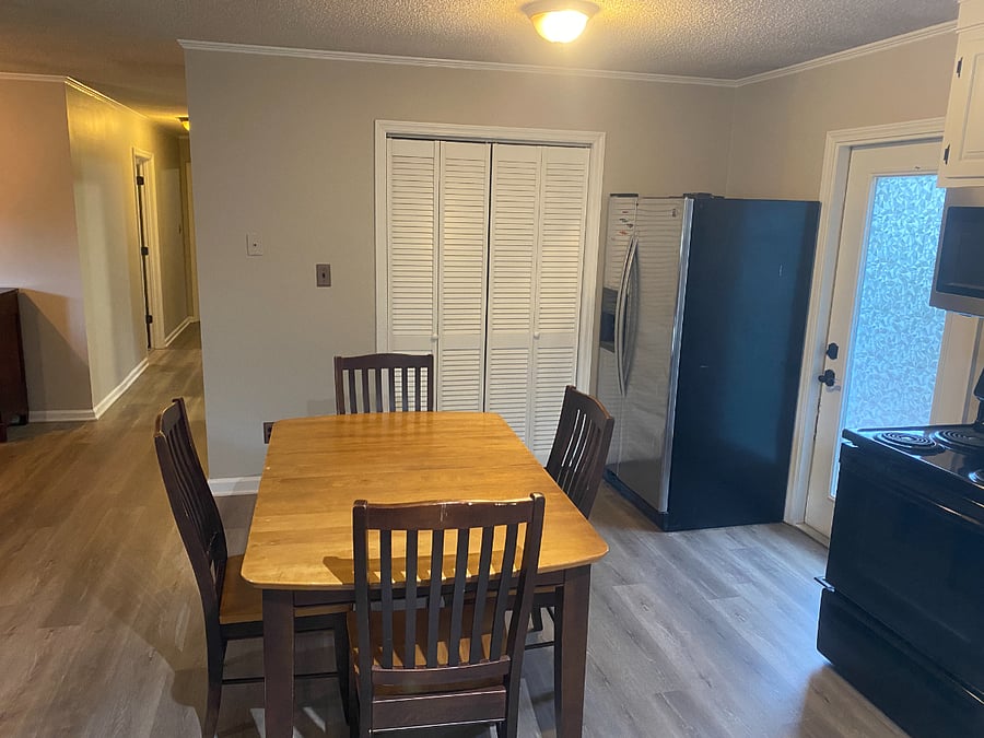 Laundry is behind those shutters. And door next to fridge is the back deck
