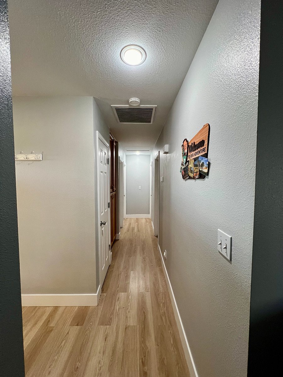 Hallway closet has extra chairs