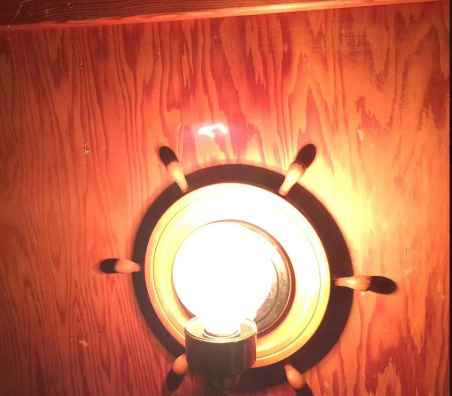 Old Crafmanship abounds like this ship's wheel window.